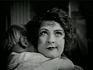 Priscilla Dean mugging with baby in arms